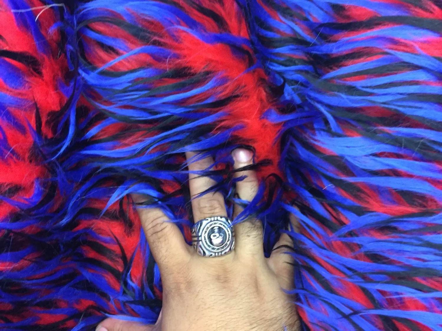 3 tone spikes faux fur- red/royal blue/black. Shaggy faux fur sold by the yard.