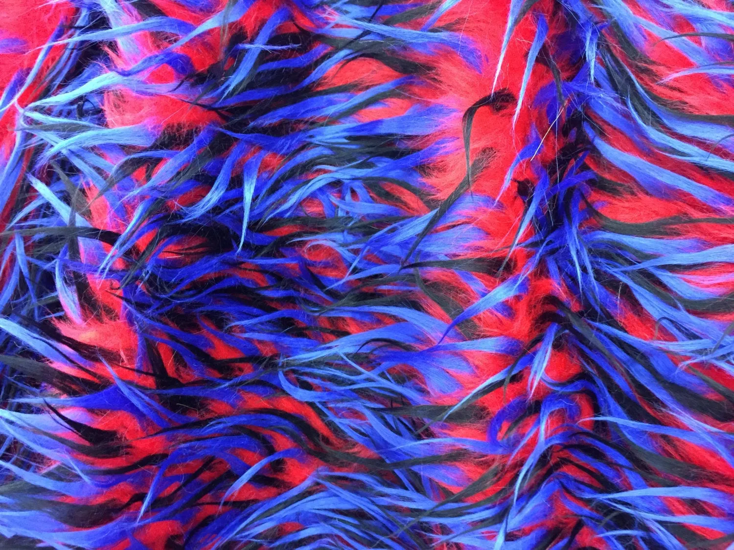 3 tone spikes faux fur- red/royal blue/black. Shaggy faux fur sold by the yard.